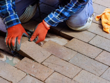 In,Reconstruction,,Destroyed,Brick,Path,Is,Replaced,With,New,One In reconstruction, destroyed brick path is replaced with new one